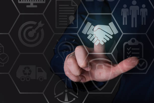 istock The businessman clicks on the handshake icon. 1345086367