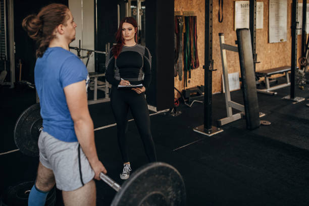 istock Man training with fitness trainer 1345086952