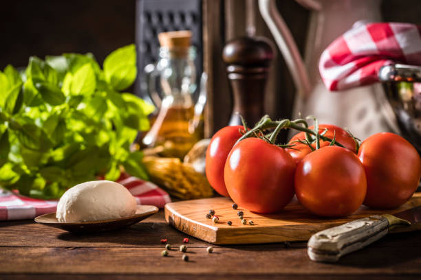 istock Mediterranean ingredients on a wooden table 1345087239