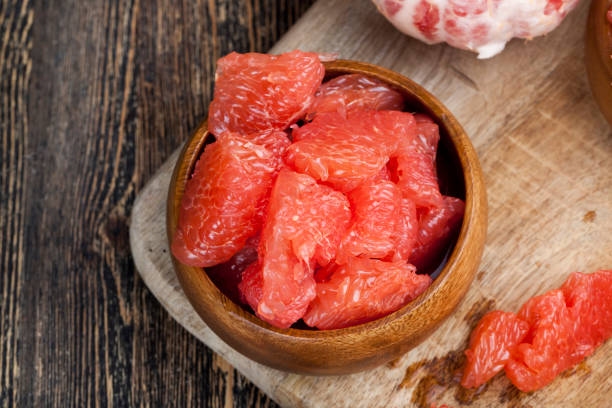 istock sour ripe grapefruit peeled and divided 1345087764