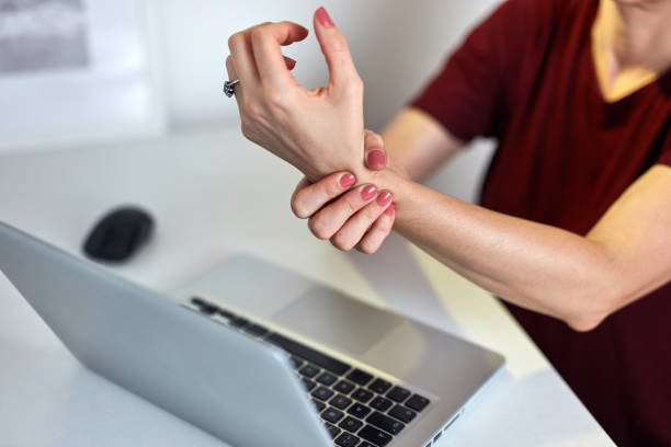 istock Freelancer working from home and having pain in the wrist. 1345089043