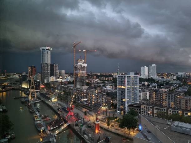 Skyline of Rotterdam, the Netherlands, against dark clouds during thunder storm