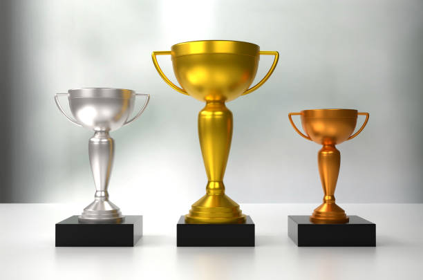 3D Golden Trophy Award On Dark Wood. Success Concept