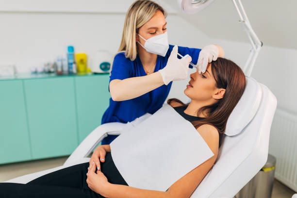 istock Young woman on cosmetic treatment 1345092329