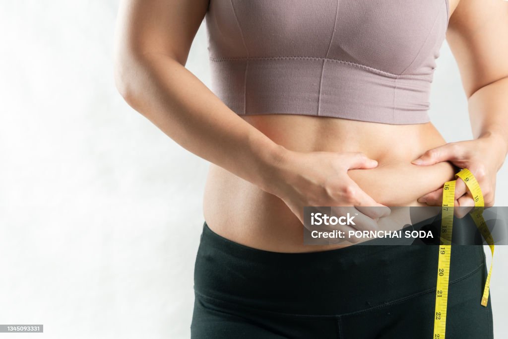 fat woman, fat belly, chubby, obese woman hand holding excessive belly fat with measure tape, woman diet lifestyle concept Dieting Stock Photo