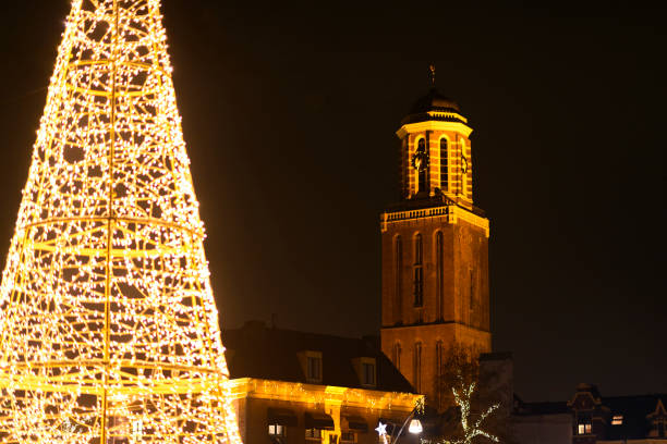 Christmas tree with old Dutch building facades during december holiday month in Zwolle, Overijssel, The Netherlands.