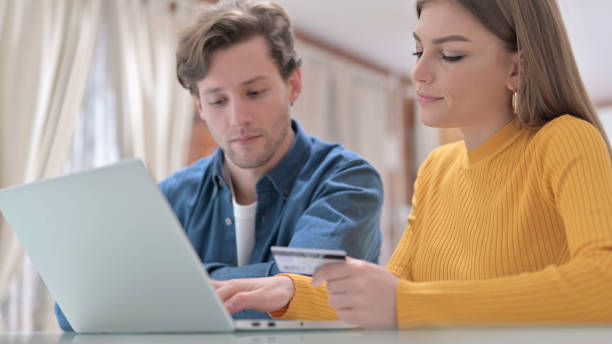 istock Serious Office Colleagues making Online Payment on Laptop 1345094958