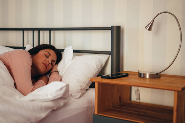 istock Young beautiful woman sleeping in her bad at home 1345095700