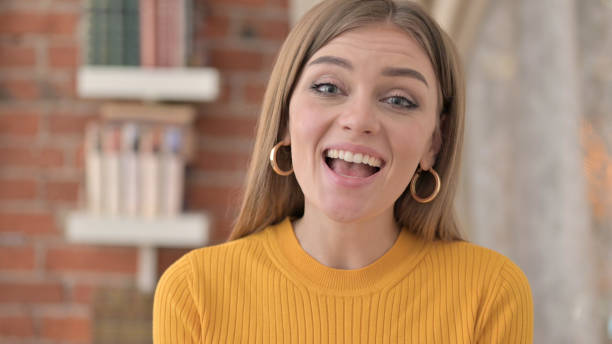 istock Happy Young Woman Talking During Video Chat 1345095863