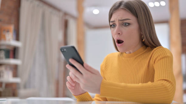 istock Woman Reacting to Failure on Smartphone 1345096006