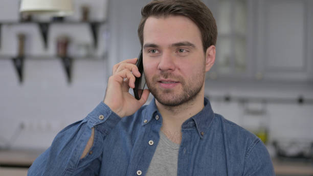 istock Portrait of Beard Young Man Talking on Smartphone 1345098534