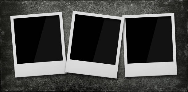 Three empty instant photo frames on wooden table Close up three empty Polaroid instant photo frames on grunge black stone table background, elevated top view, directly above three objects photos stock pictures, royalty-free photos & images