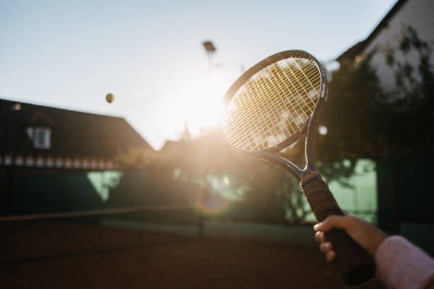 Tennis racket and a ball Tennis racket after hitting a ball tennis tournament stock pictures, royalty-free photos & images