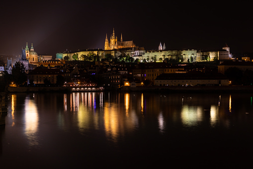 Prague, Czech Republic (Czechia) - October 3, 2021: The Prague skyline at night reflecting in the Vltava River.