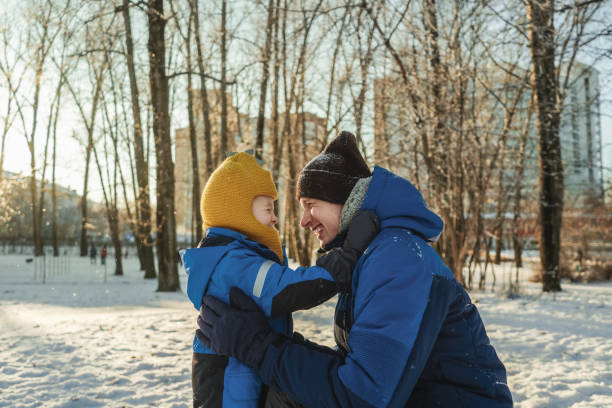 istock Father with his son in winter park 1345101243