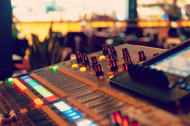 istock Working sound panel. Sound mixer. Professional audio mixing console with lights, buttons, faders and sliders 1345101874