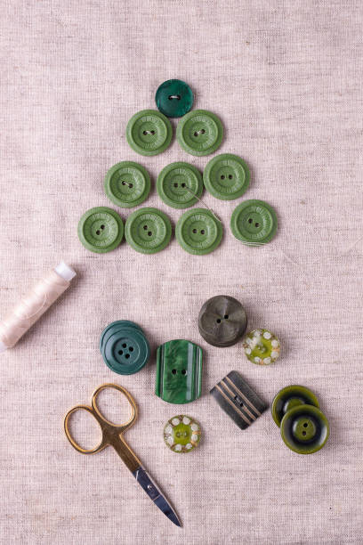 istock Christmas tree made of green buttons on linen fabric. Step 1. 1345101901