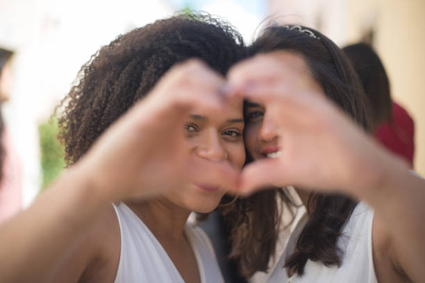 istock Close-up of brides making heart sign 1345103336