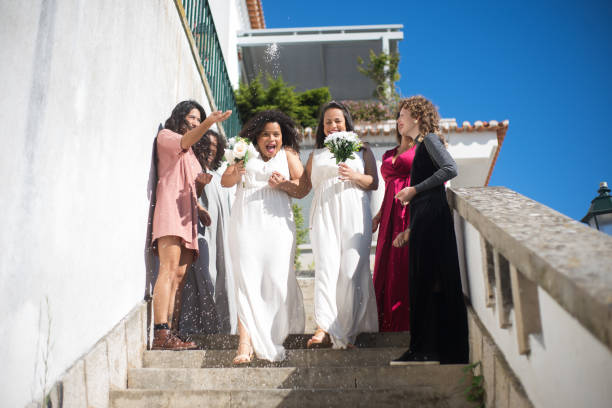istock Happy brides and guests at wedding 1345103352