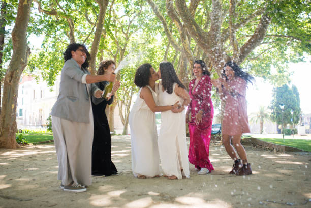 istock Happy brides and guests celebrating wedding 1345103359