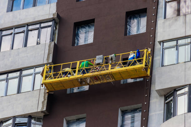 istock Suspended platform or cradle for construction, installation and repair work of building facades of skyscrapers at high altitude 1345103929