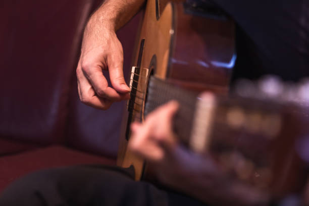istock Man playing acoustic guitar 1345105186
