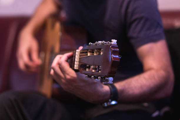 istock Man playing acoustic guitar 1345105214