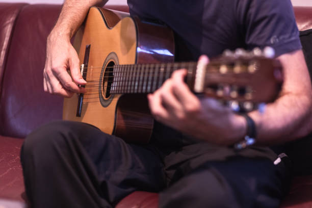 istock Man playing acoustic guitar 1345105216