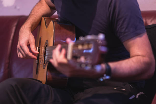 Man playing acoustic guitar