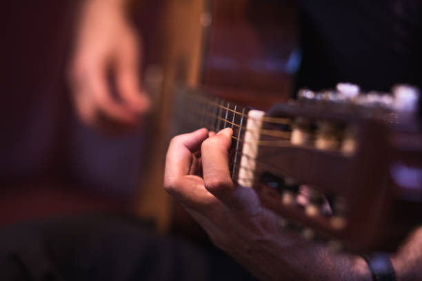 istock Man playing acoustic guitar 1345105338