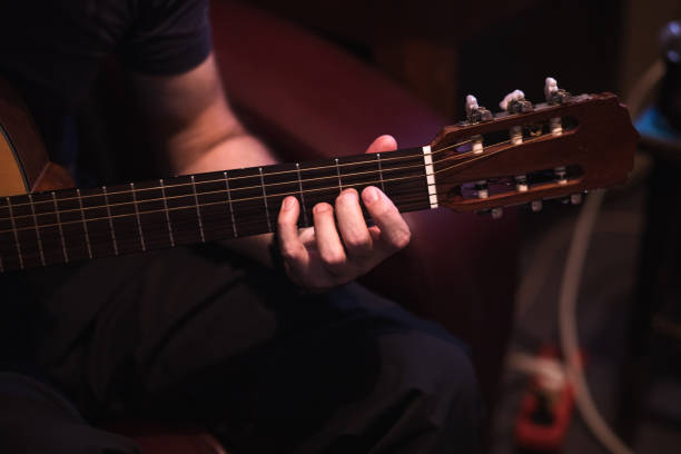 istock Man playing acoustic guitar 1345105339