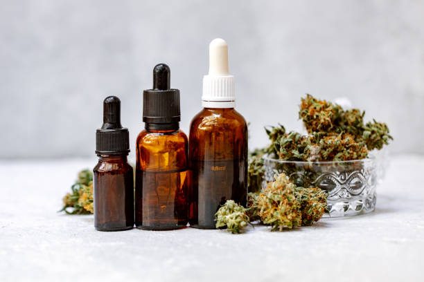 cannabis herb and leaves with oil extracts in jars. medical concept, marijuana cbd oil hemp products. - medical marijuana imagens e fotografias de stock