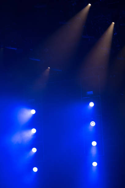 istock Stage lights glowing in the dark 1345108222