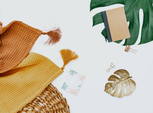 istock Two blankets and monstera leaf on white background, minimal simple background. 1345108231