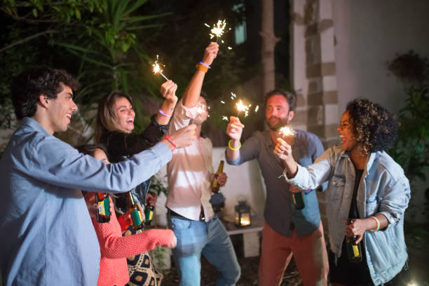 istock Young men and women partying at backyard 1345108846