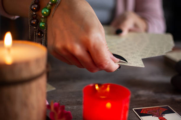 istock Fortune teller reading a future by tarot cards 1345108961