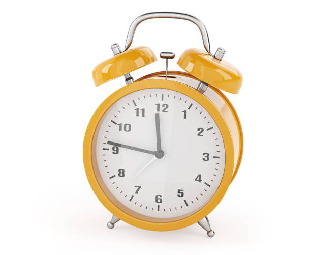 istock Yellow alarm clock isolated on white background 1345110474