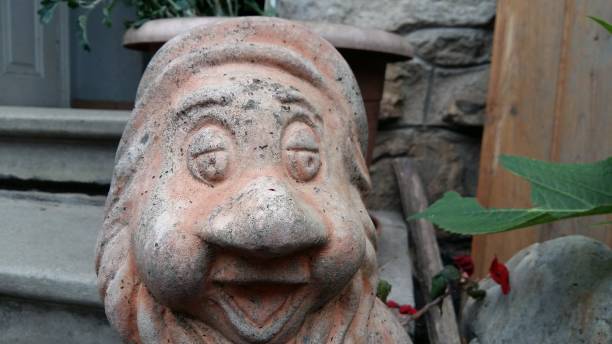 istock close up of an old dwarf statue 1345114828