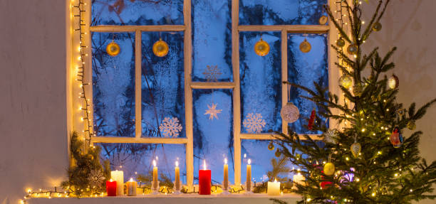 istock Christmas decorations on old wooden window 1345117247