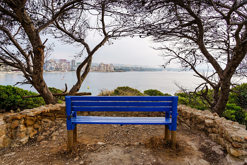 Bench to sit and contemplate the seascape with the city by the sea. Calpe Alicante.