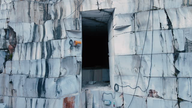 Zoom Out From a Cave in Marble Quarry