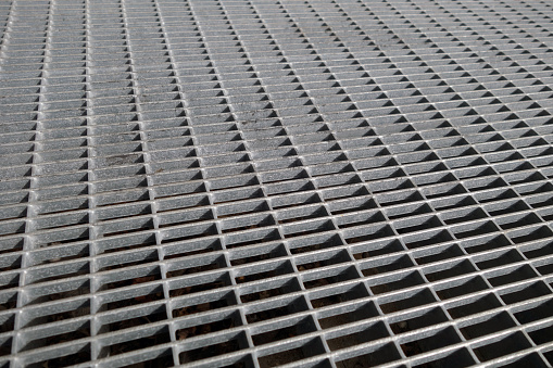 Metal grid pattern with blur effect. Abstract architectural background and texture for design.