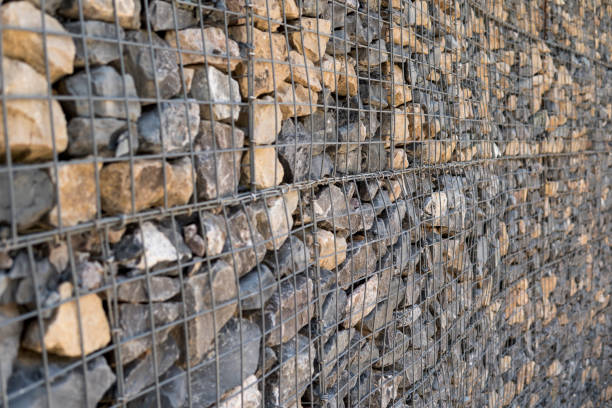 istock stones behind metal fence 1345124639