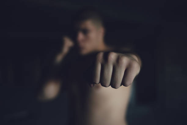 istock A kickboxing man trains alone in an abandoned building 1345126062