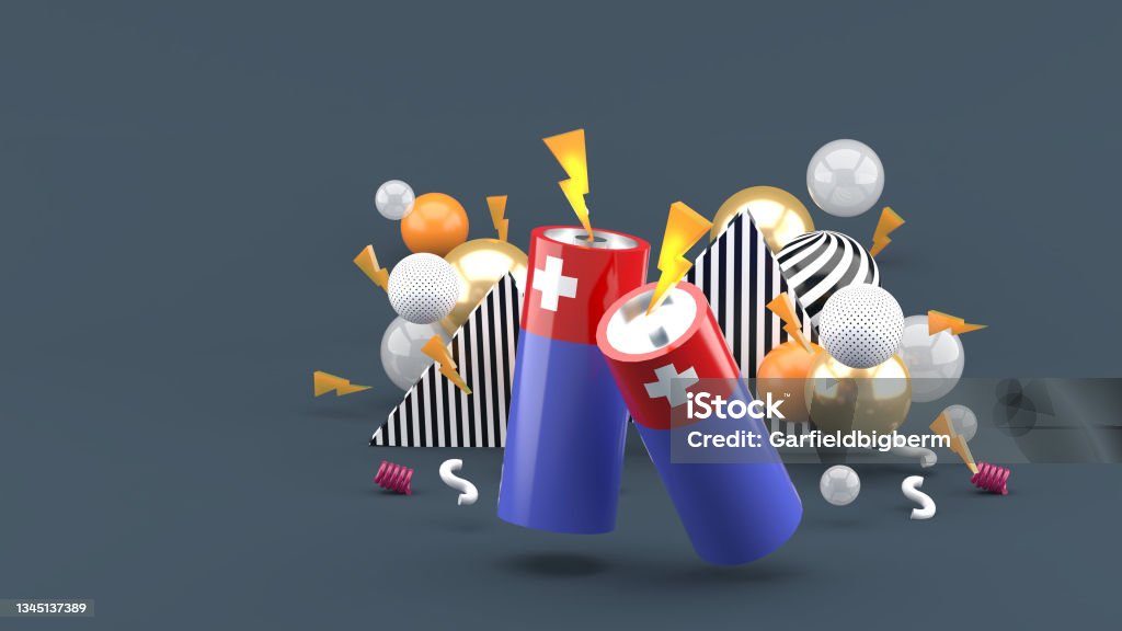 Battery among the colorful balls on the gray background.-3d rendering. AARP Stock Photo