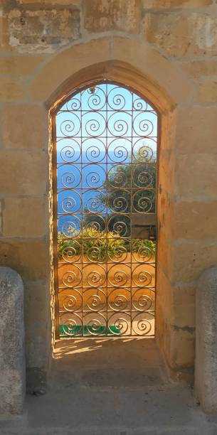 istock Door with grids with sea view in Malta 1345137672