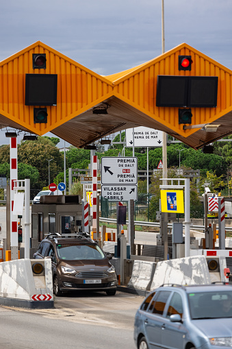 Maresme, Catalonia, Spain - September 27th, 2021: Vertical view of the Toll booth structure of C-32 catalan motorway, Vilassar de Dalt and Premià de Dalt signs, on September 27th, 2021.