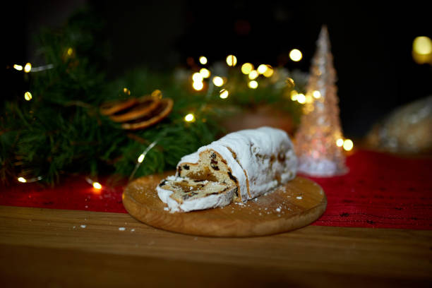istock Stollen German christmas bread, Christmas stollen on wooden background 1345143681