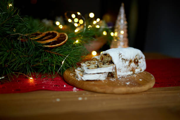 istock Stollen German christmas bread, Christmas stollen on wooden background 1345143693