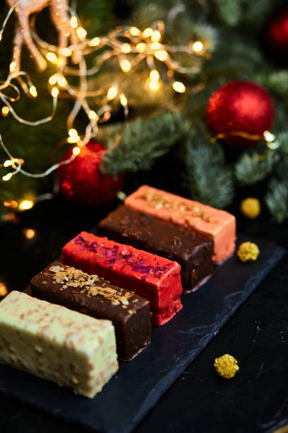 istock Mousse Christmas pastry mini cake dessert with new year decorations 1345143707